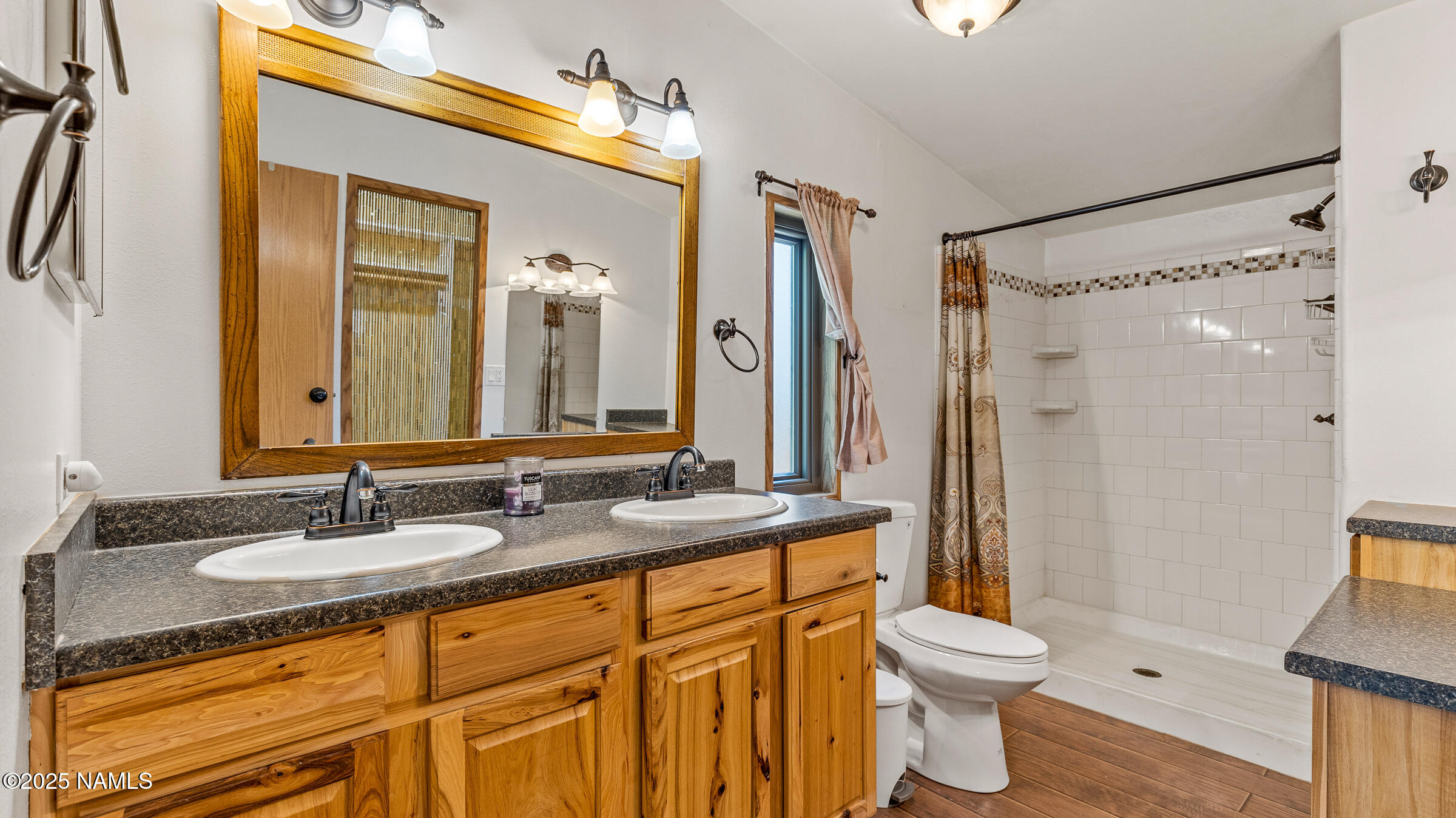 10350 Ghost Rider Trail Flagstaff, AZ 86004 - Photo 11 of 39 a bathroom with a granite countertop sink toilet and shower