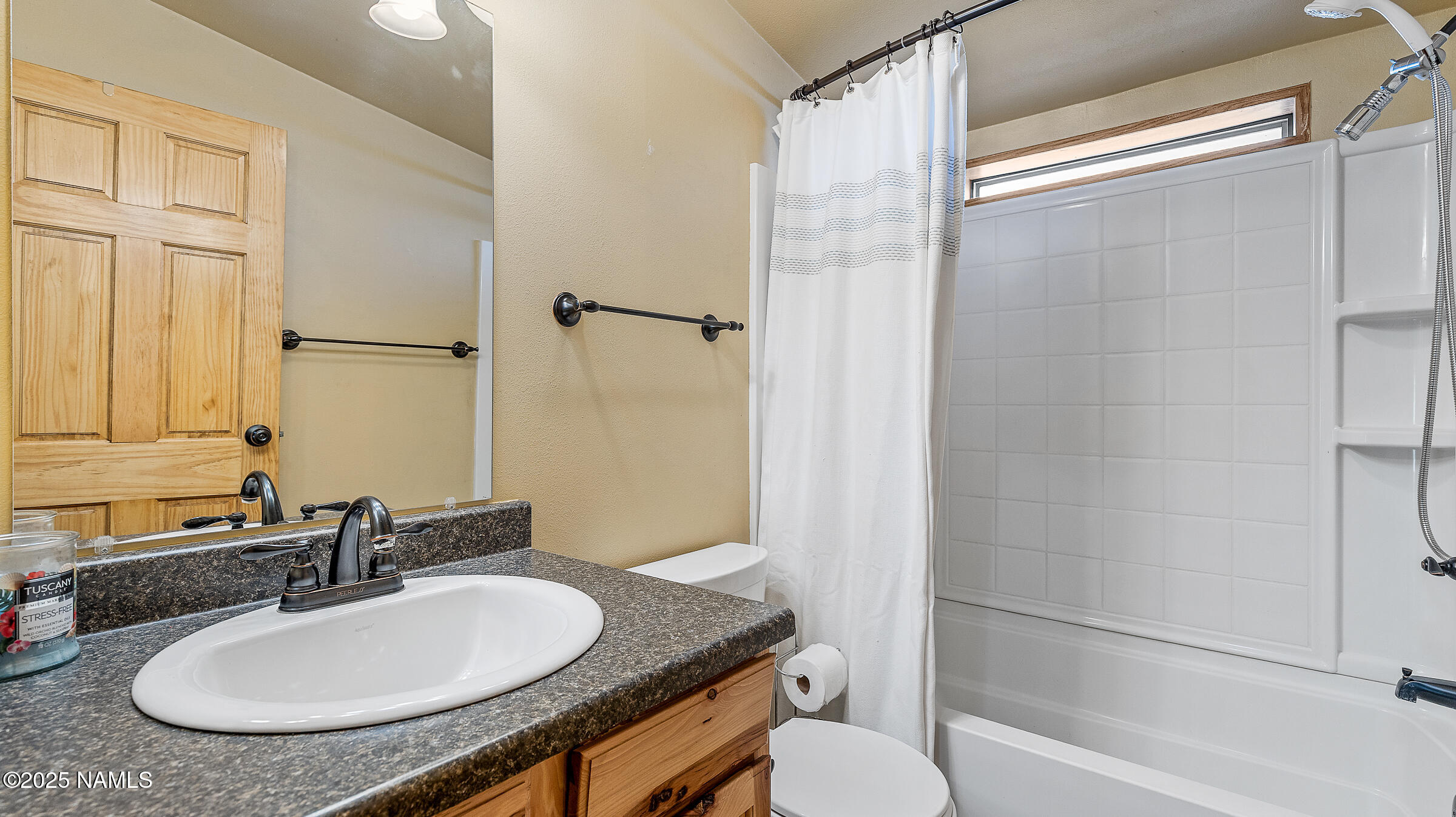10350 Ghost Rider Trail Flagstaff, AZ 86004 - Photo 17 of 39 a bathroom with a granite countertop sink toilet and shower