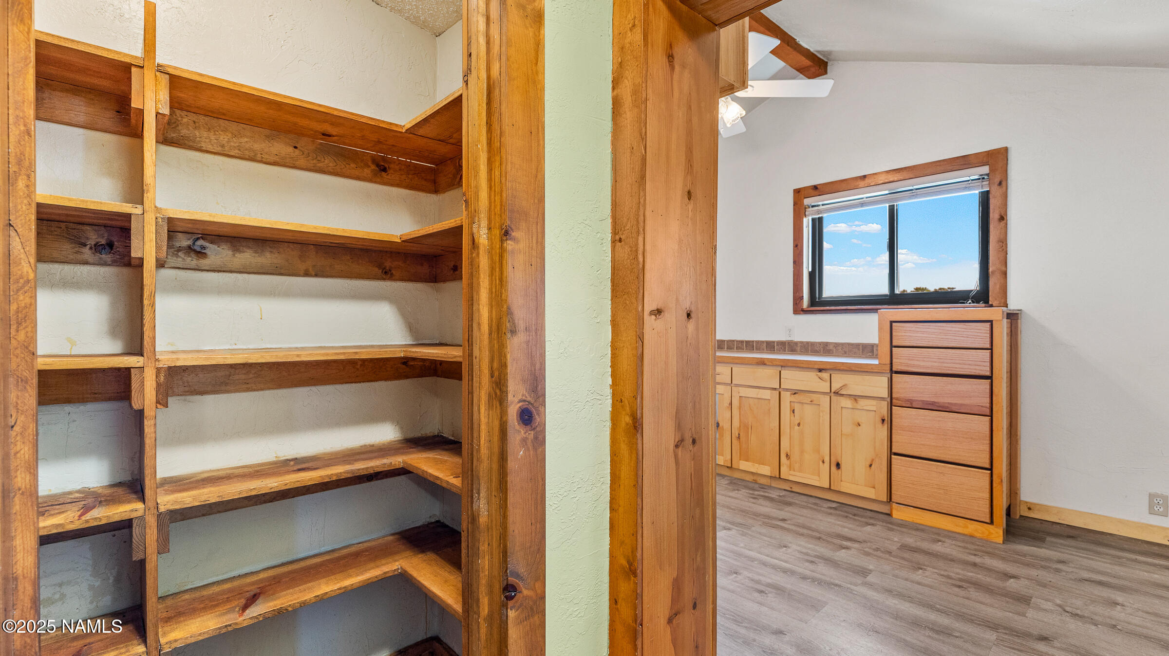 10350 Ghost Rider Trail Flagstaff, AZ 86004 - Photo 18 of 39 a view of walk in closet with empty racks