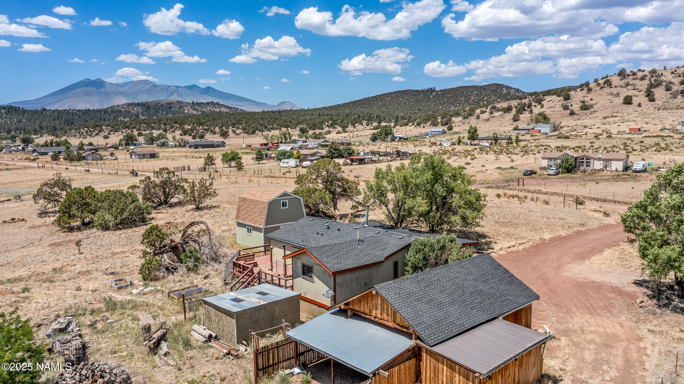 10350 Ghost Rider Trail Flagstaff, AZ 86004 - Photo 2 of 39 a view of a city with mountains in the background