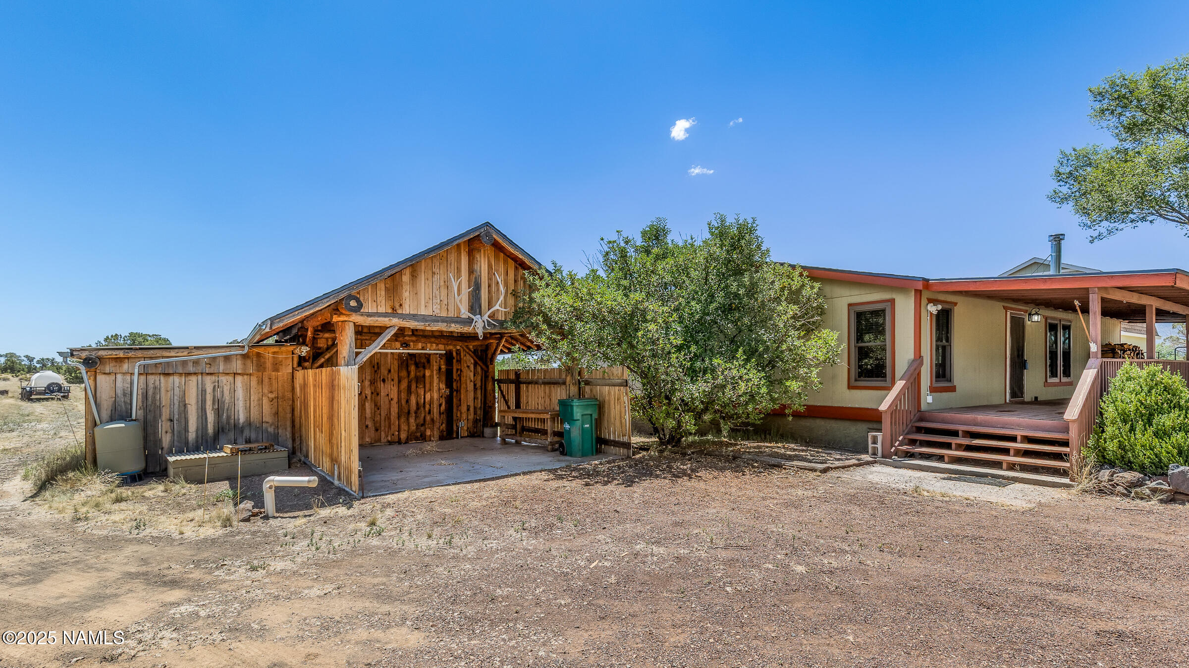 10350 Ghost Rider Trail Flagstaff, AZ 86004 - Photo 22 of 39 a view of a house with wooden fence