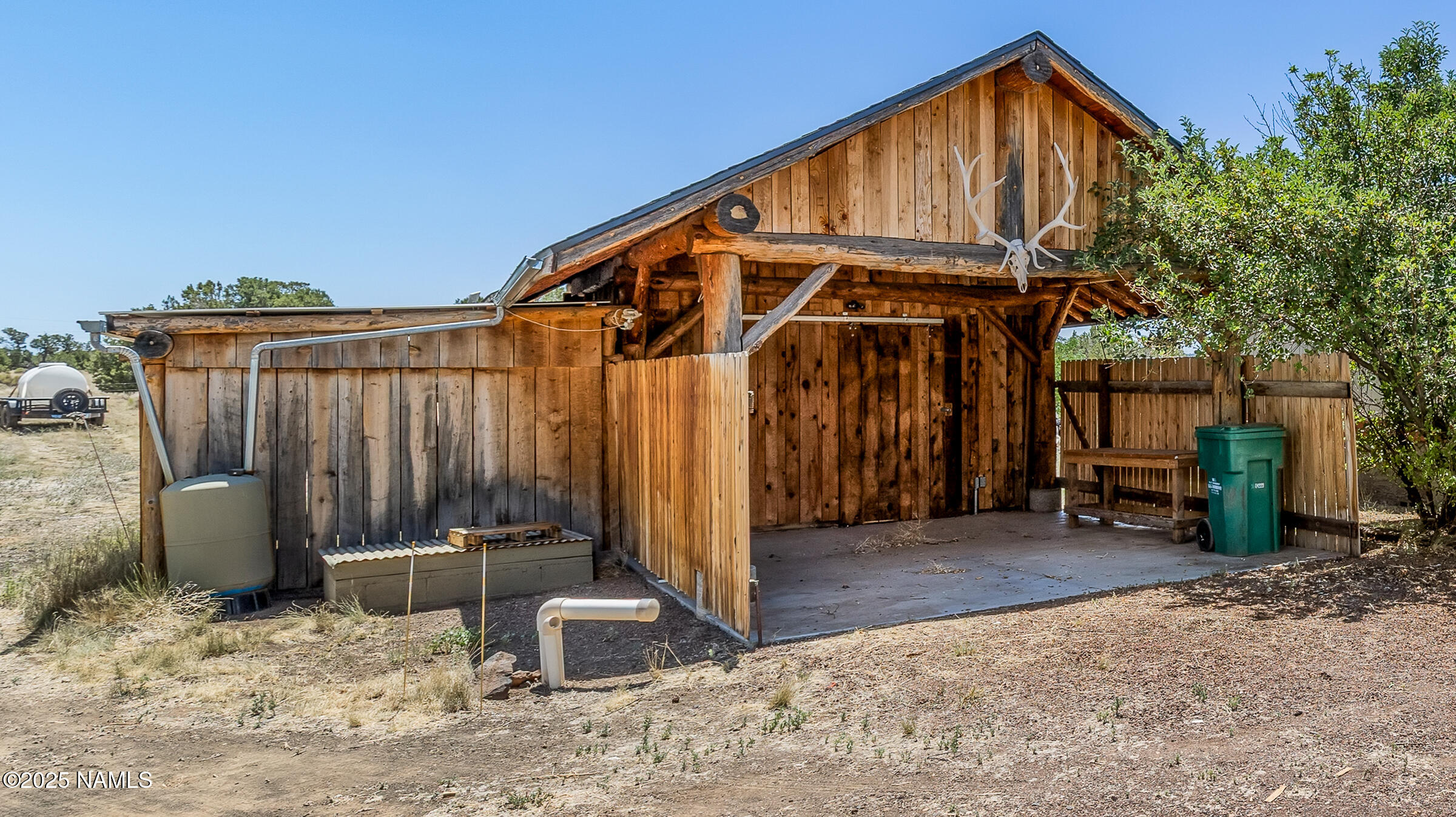 10350 Ghost Rider Trail Flagstaff, AZ 86004 - Photo 23 of 39 a view of a house with backyard and sitting area