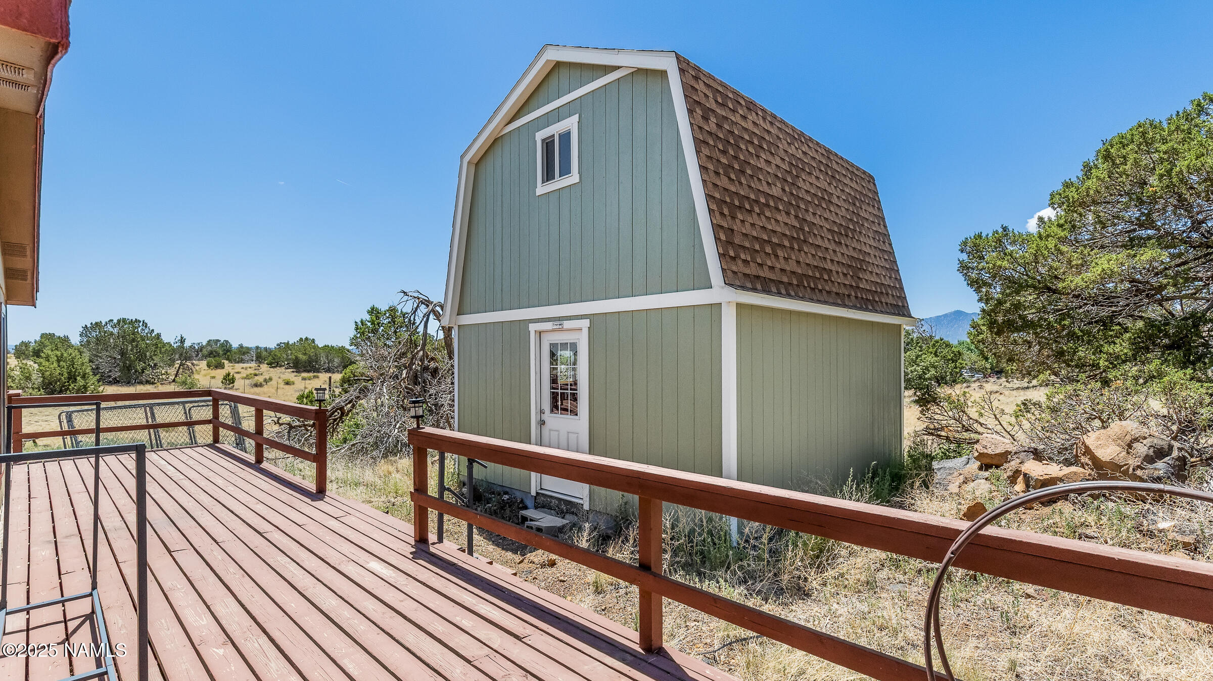 10350 Ghost Rider Trail Flagstaff, AZ 86004 - Photo 28 of 39 a view of balcony with wooden floor and fence