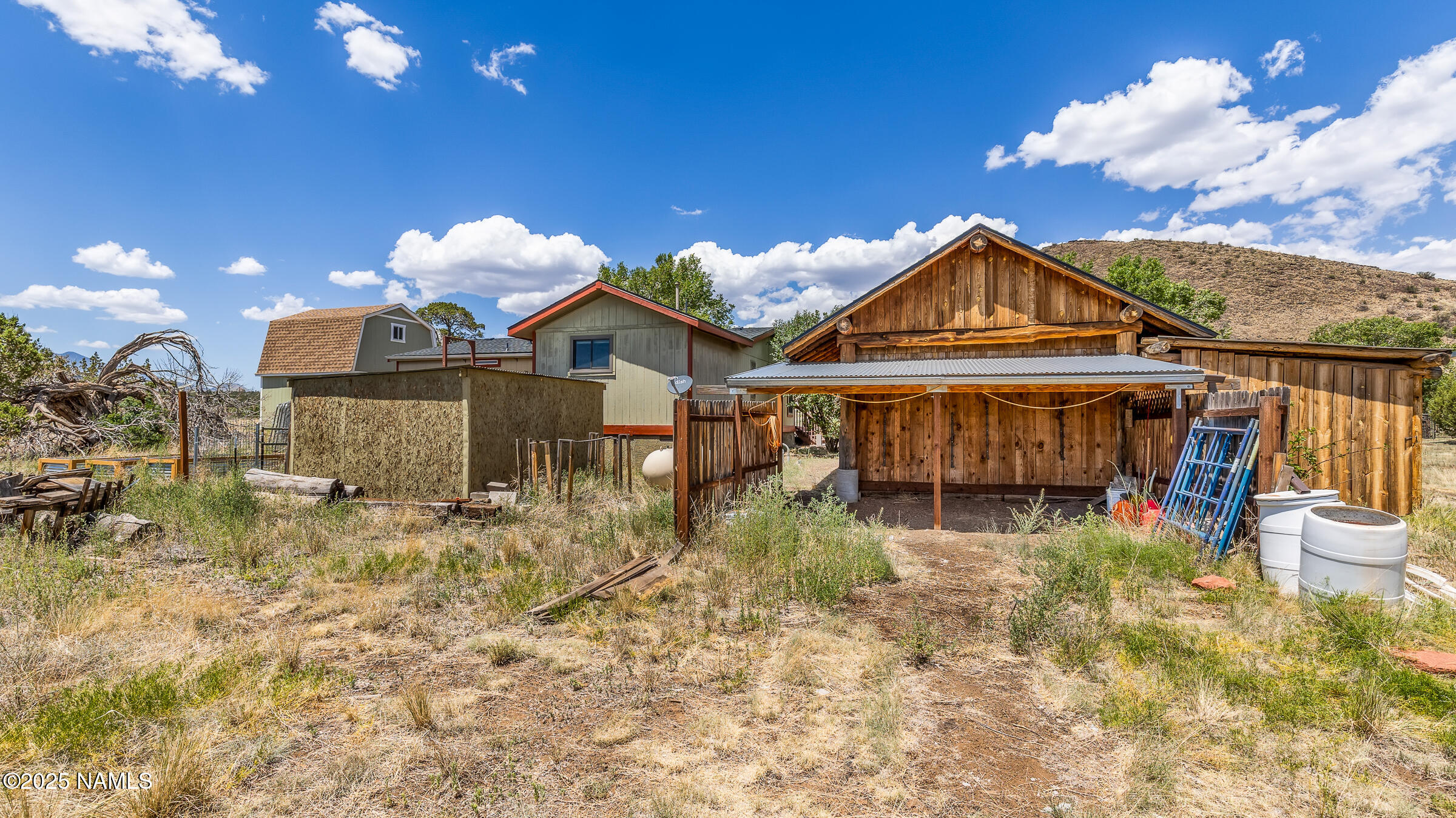 10350 Ghost Rider Trail Flagstaff, AZ 86004 - Photo 29 of 39 a front view of a house with a yard