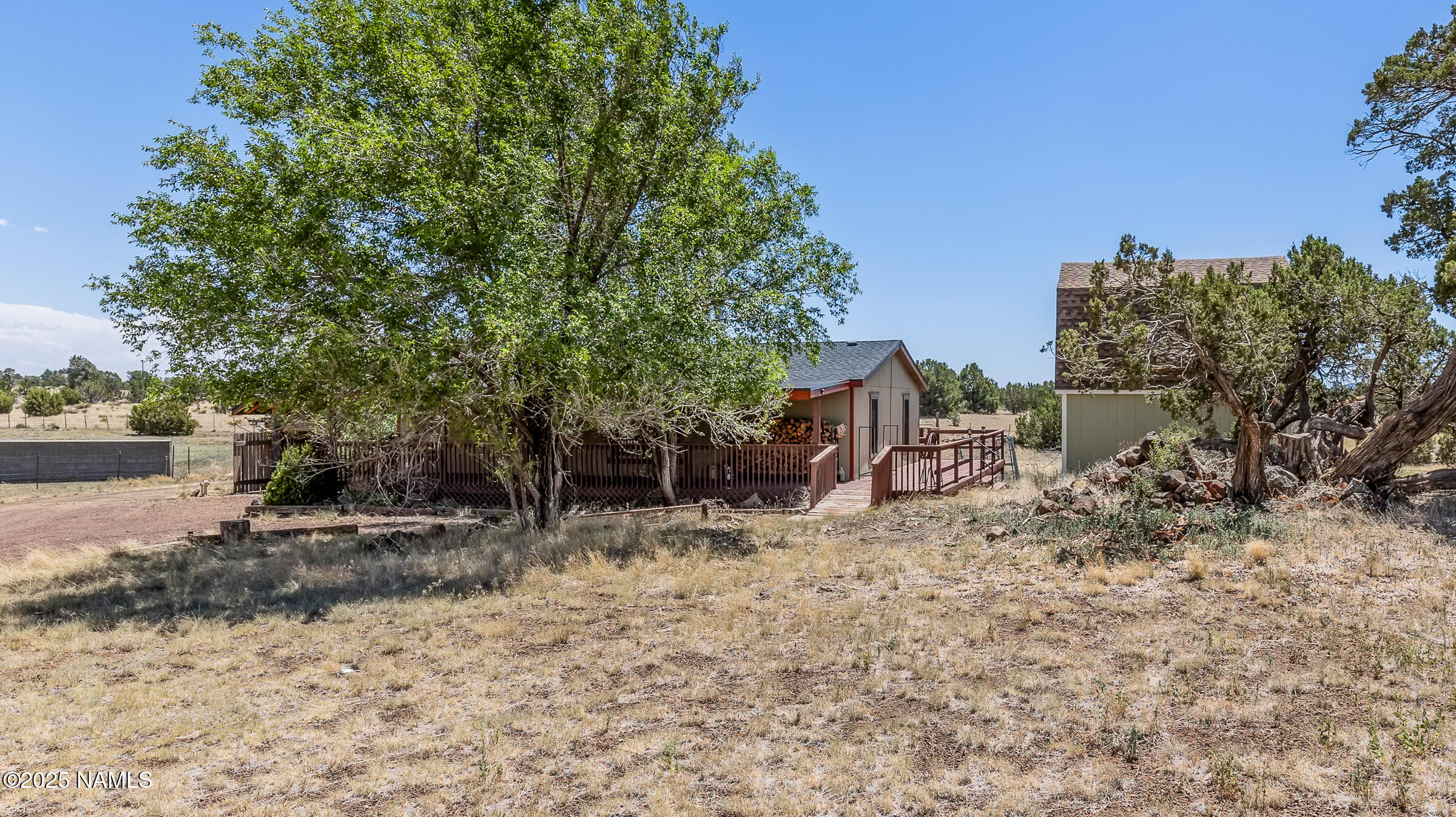 10350 Ghost Rider Trail Flagstaff, AZ 86004 - Photo 30 of 39 a backyard of a house with lots of green space
