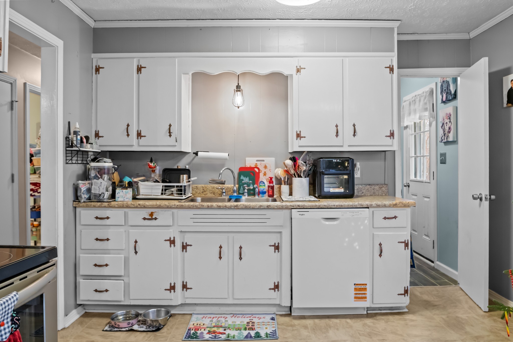 58 Florence Street McEwen, TN 37101 - Photo 11 of 20 a kitchen with stainless steel appliances a stove and cabinets