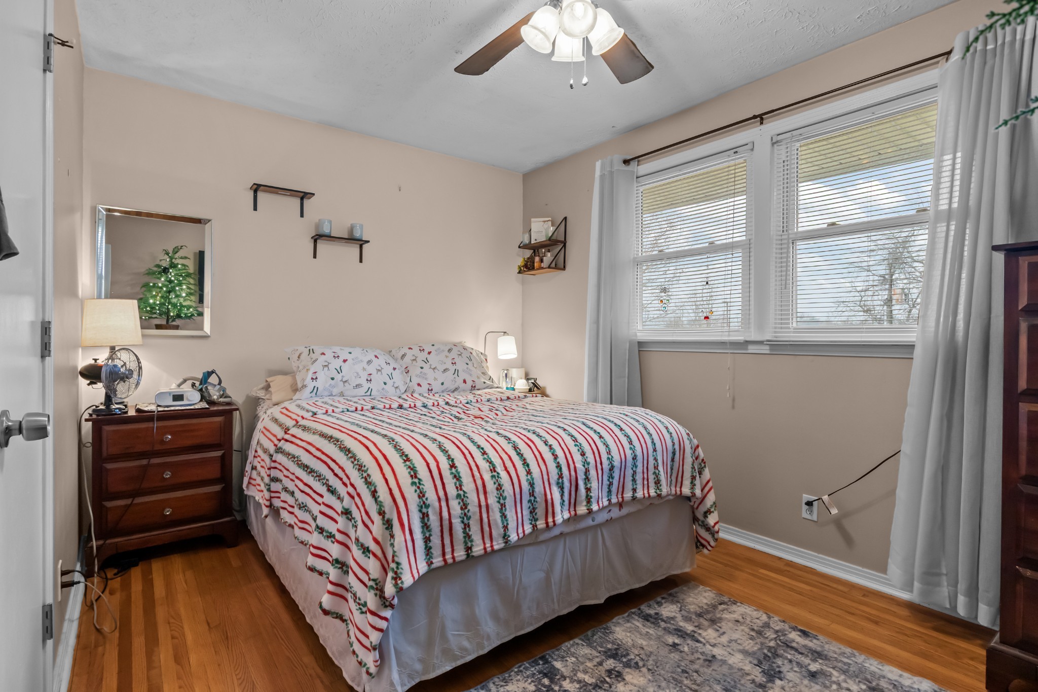 58 Florence Street McEwen, TN 37101 - Photo 12 of 20 a bedroom with a bed and wooden floor