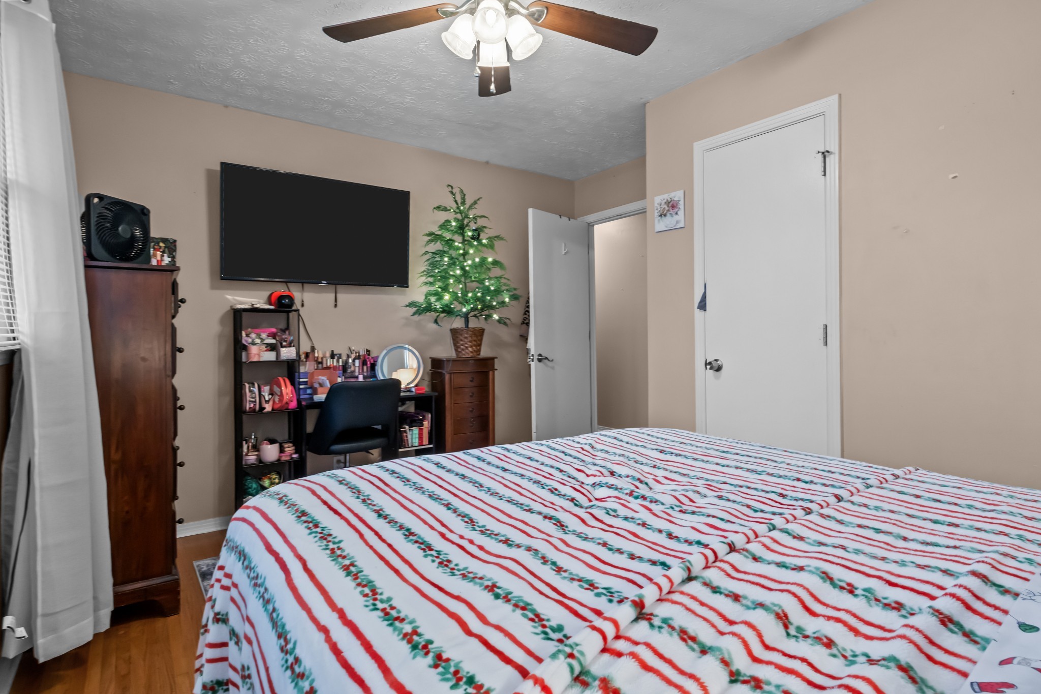 58 Florence Street McEwen, TN 37101 - Photo 13 of 20 a bedroom with a bed and a flat screen tv