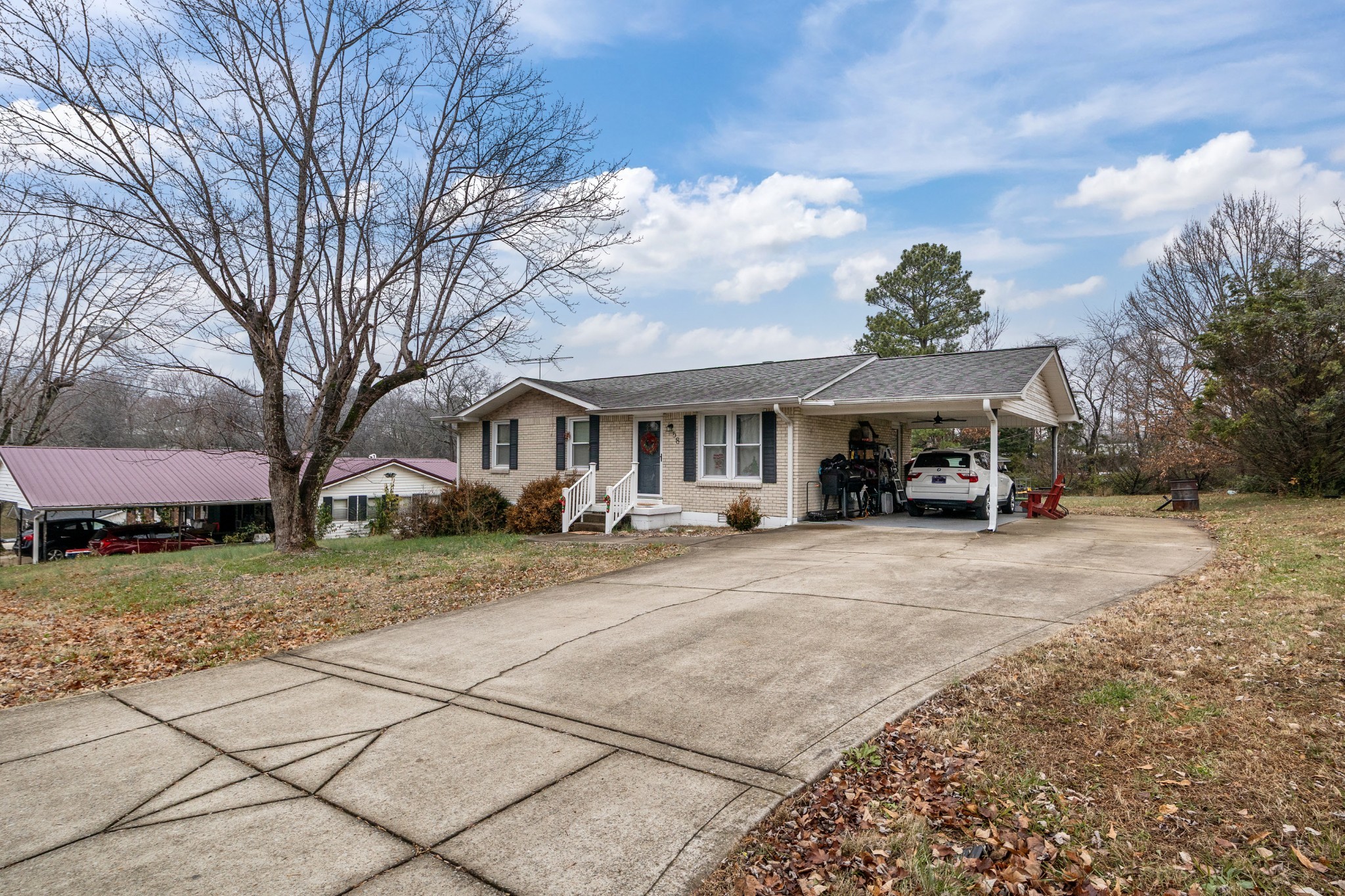 58 Florence Street McEwen, TN 37101 - Photo 2 of 20 a view of a house with a yard and large trees