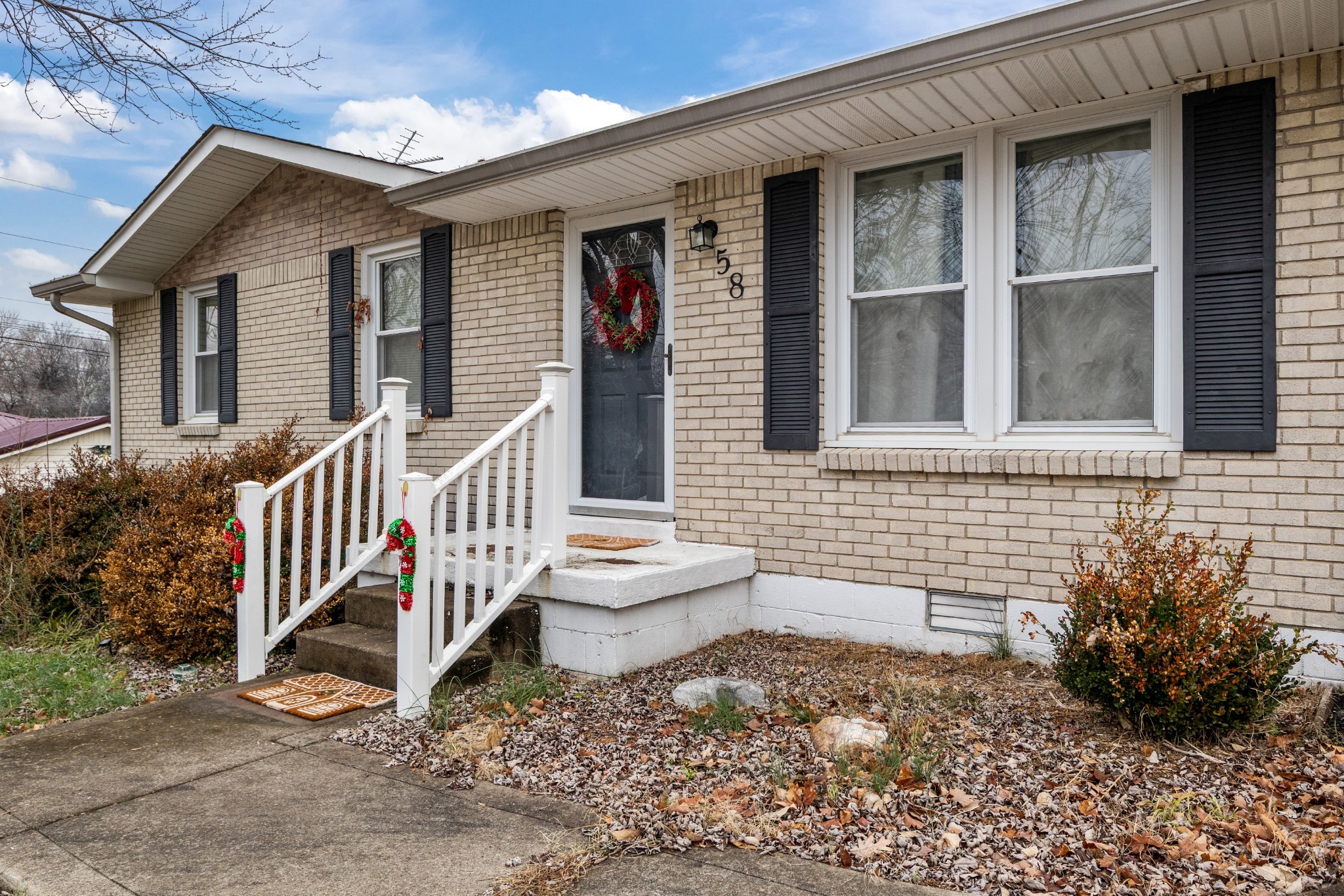 58 Florence Street McEwen, TN 37101 - Photo 3 of 20 a front view of a house with a yard