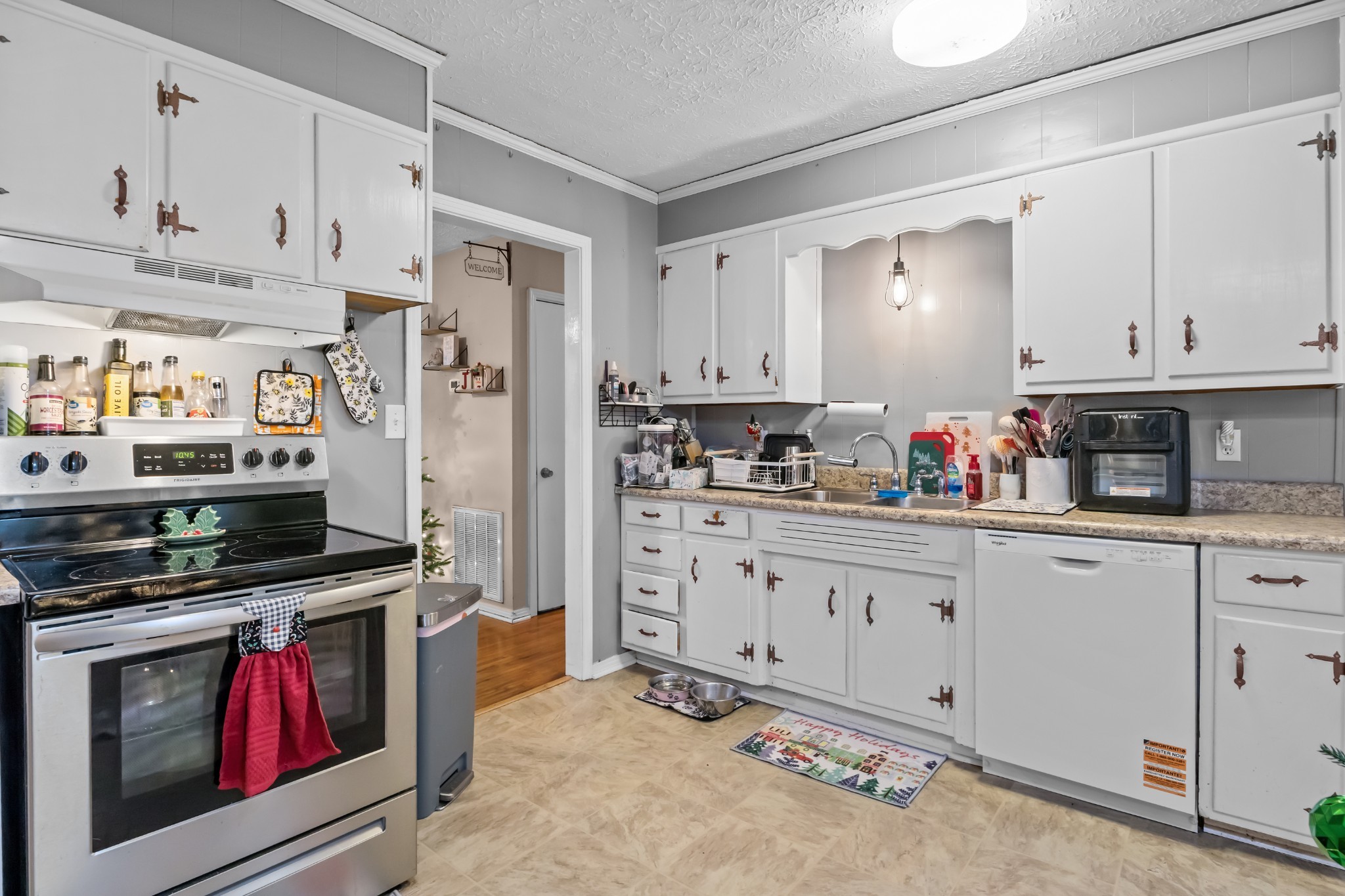 58 Florence Street McEwen, TN 37101 - Photo 7 of 20 a kitchen with stainless steel appliances granite countertop a stove and a refrigerator