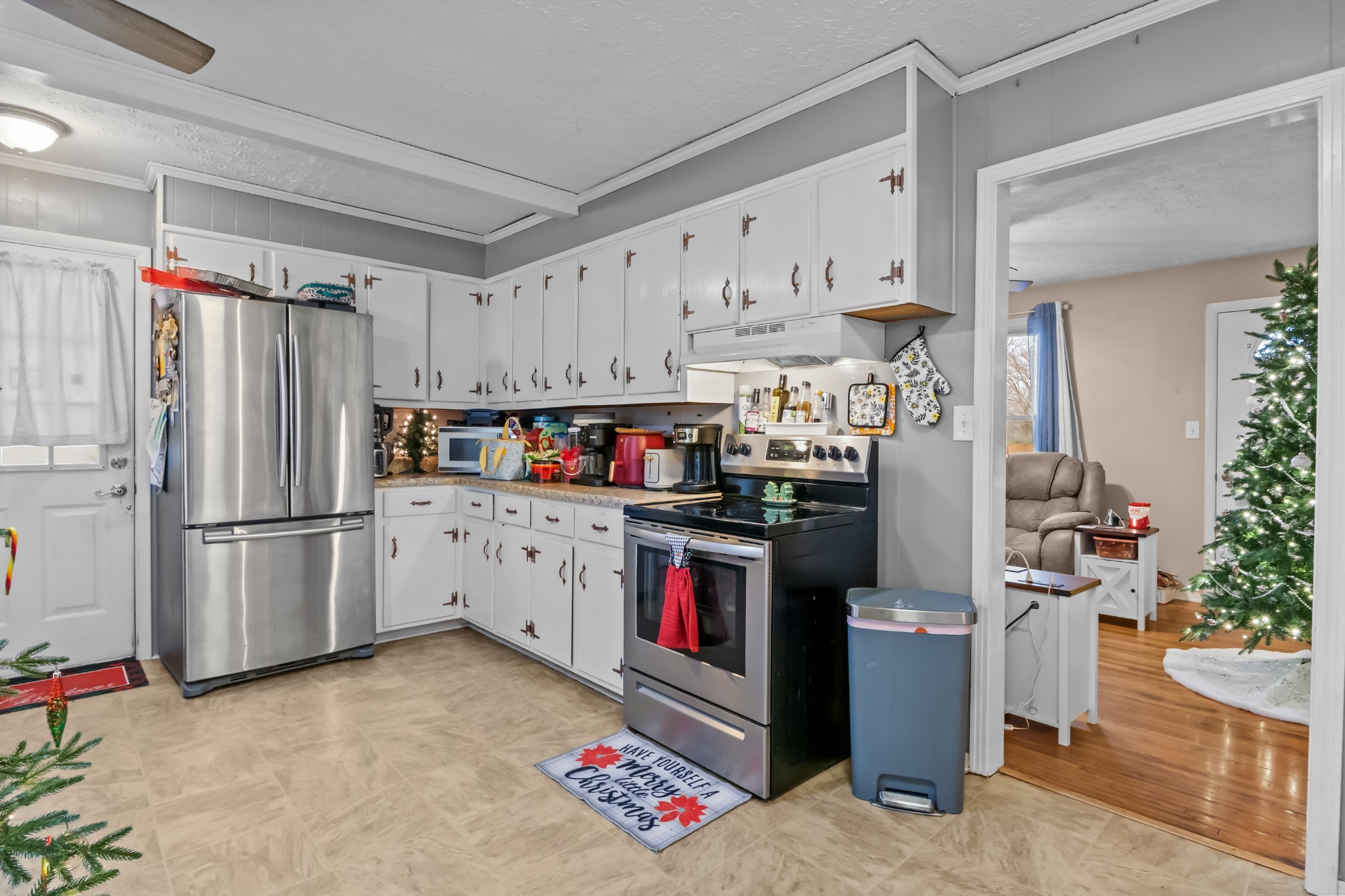 58 Florence Street McEwen, TN 37101 - Photo 8 of 20 a kitchen with refrigerator and cabinets