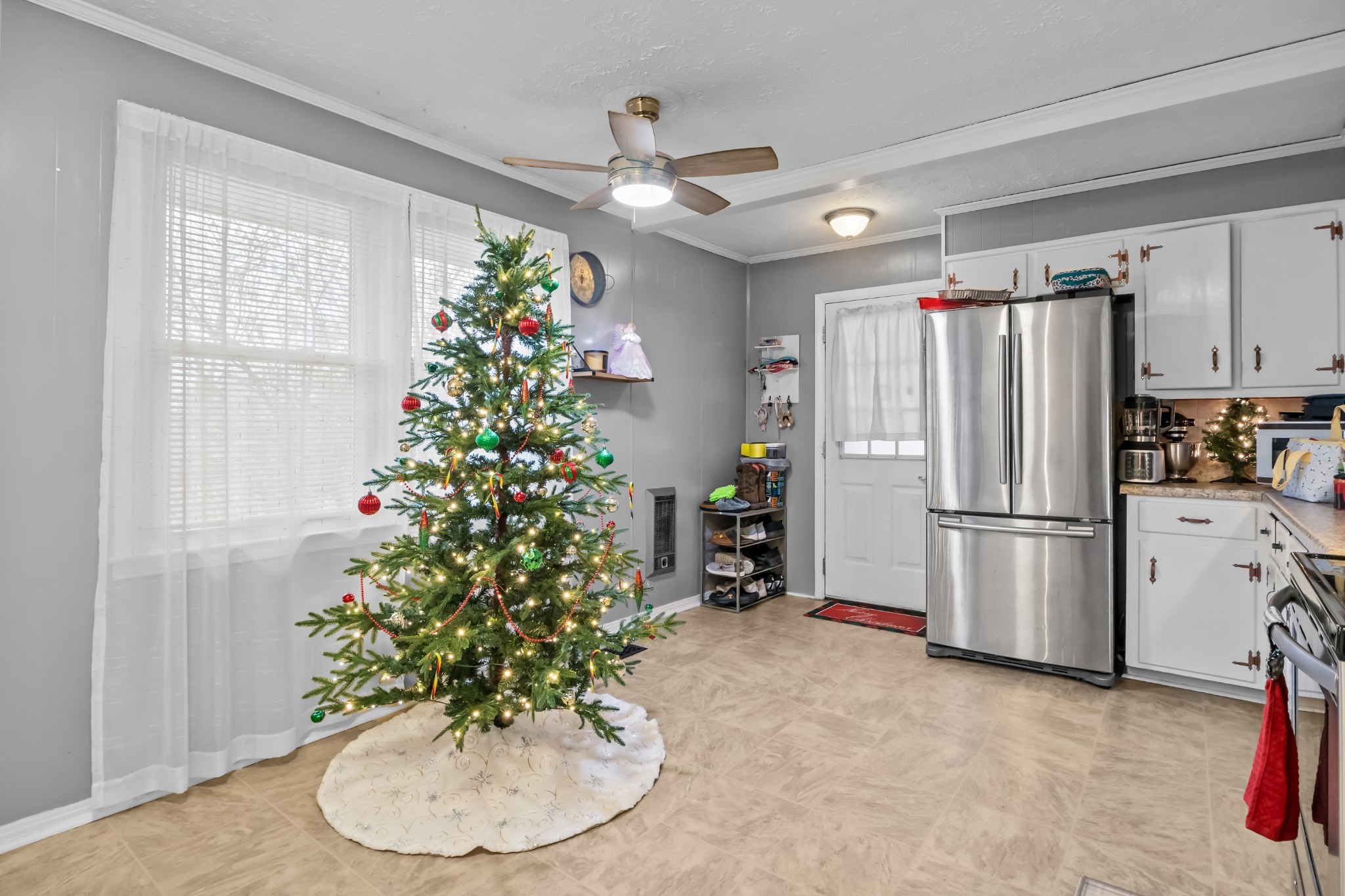 58 Florence Street McEwen, TN 37101 - Photo 9 of 20 a kitchen with a refrigerator and a stove