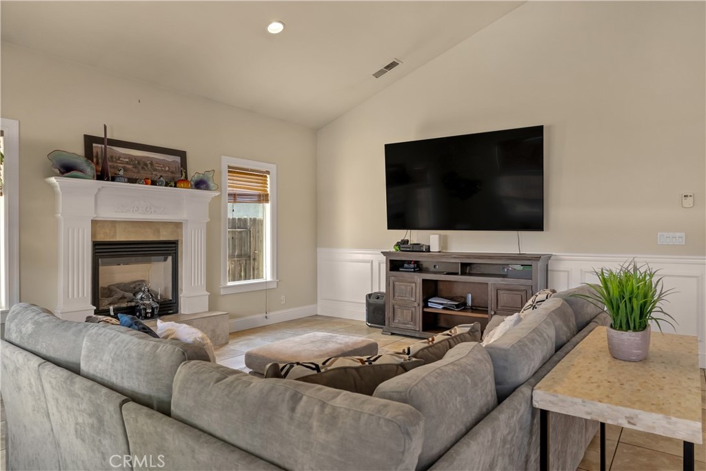 39 Redeemers Loop Chico, CA 95973 - Photo 12 of 55 a living room with furniture and a flat screen tv