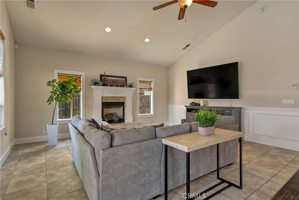 39 Redeemers Loop Chico, CA 95973 - Photo 13 of 55 a living room with furniture and a flat screen tv