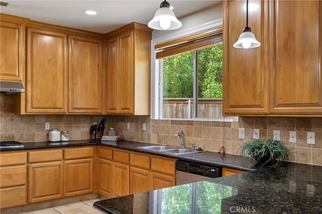 39 Redeemers Loop Chico, CA 95973 - Photo 24 of 55 a kitchen with a large window and cabinets