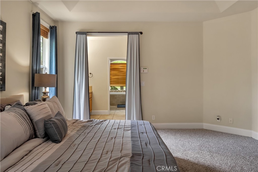 39 Redeemers Loop Chico, CA 95973 - Photo 30 of 55 a bedroom with a bed and wooden floor