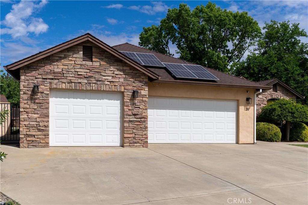 39 Redeemers Loop Chico, CA 95973 - Photo 3 of 55 a front view of a house with a garage