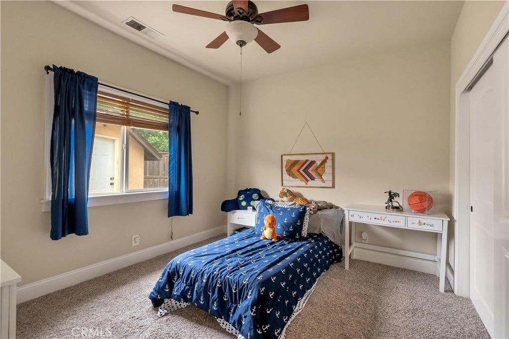 39 Redeemers Loop Chico, CA 95973 - Photo 37 of 55 a bedroom with a bed and a window