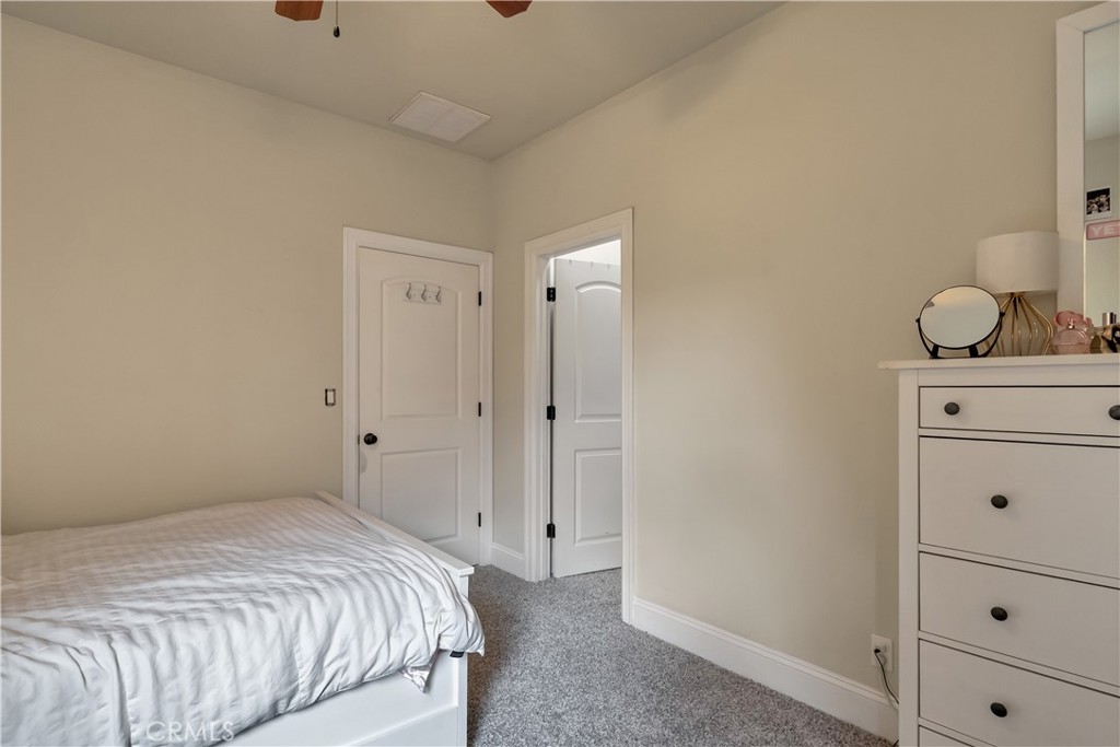 39 Redeemers Loop Chico, CA 95973 - Photo 39 of 55 a bedroom with a bed and cabinets