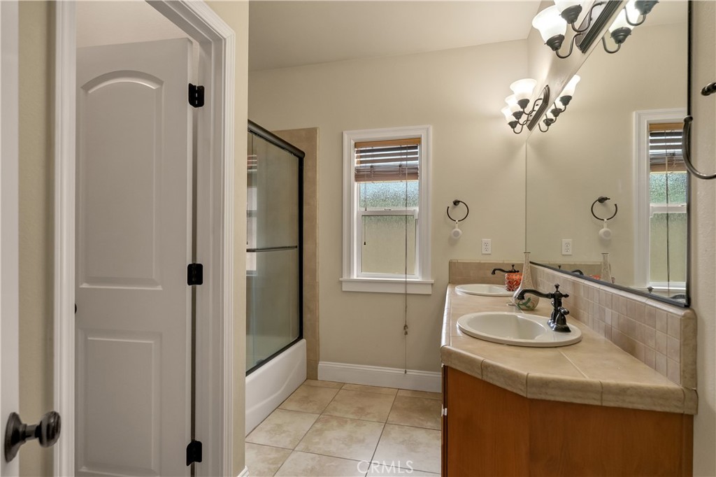 39 Redeemers Loop Chico, CA 95973 - Photo 42 of 55 a bathroom with a sink and a mirror