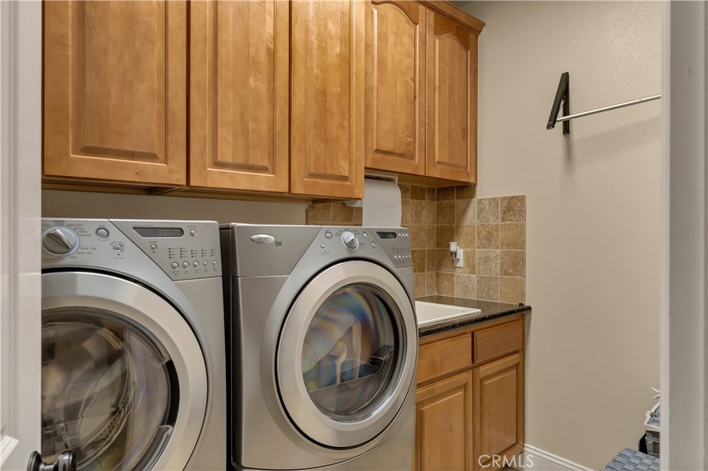 39 Redeemers Loop Chico, CA 95973 - Photo 43 of 55 a utility room with dryer and washer