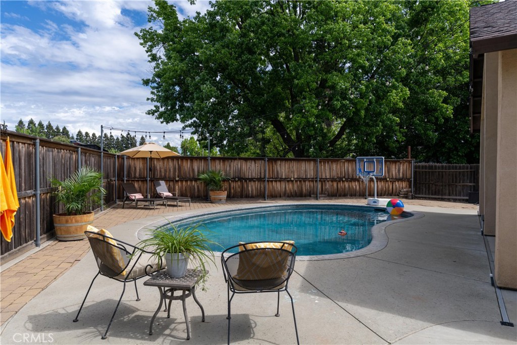 39 Redeemers Loop Chico, CA 95973 - Photo 44 of 55 a view of a backyard with swimming pool and furniture