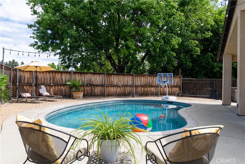 39 Redeemers Loop Chico, CA 95973 - Photo 45 of 55 a view of a swimming pool with a lounge chair