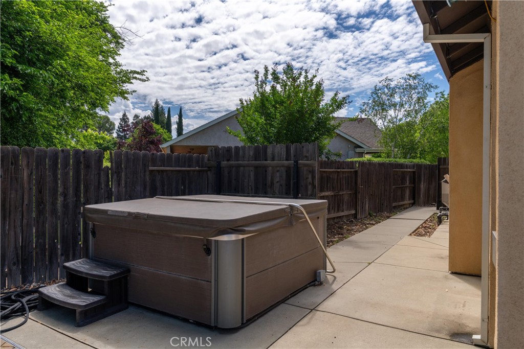 39 Redeemers Loop Chico, CA 95973 - Photo 50 of 55 a view of a backyard with a small cabin and a chair