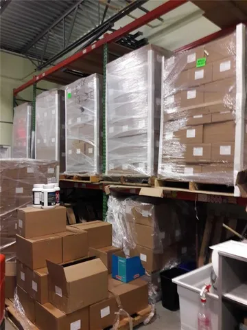 a kitchen with a stove a sink and a wooden cabinets