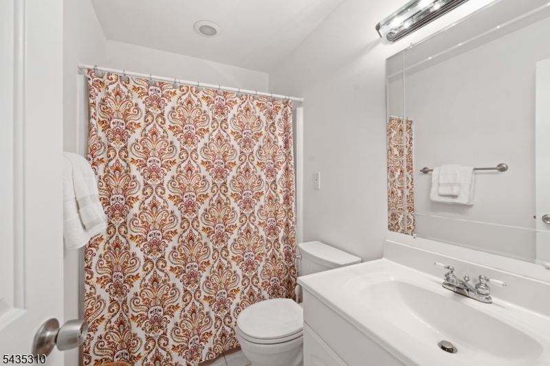 488 Auten Road, Unit 2D Hillsborough, NJ 08844 - Photo 19 of 30 a bathroom with a sink toilet and shower