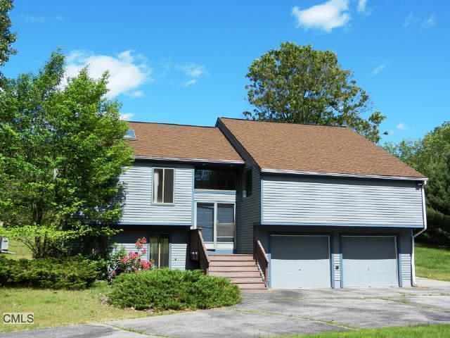 119 High Rock Road Newtown, CT 06482 - Photo 1 of 1 a front view of a house with garden