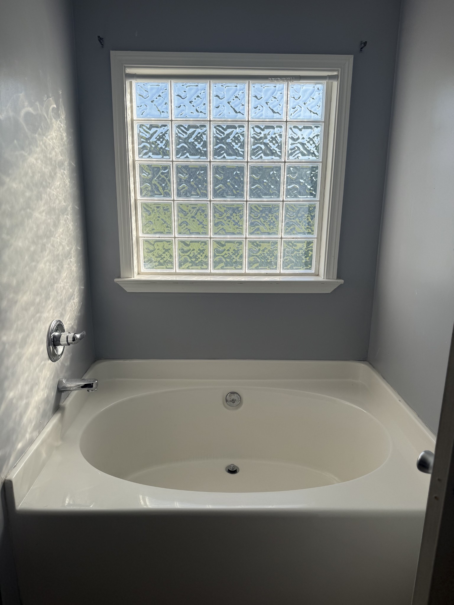 1702 Abiff Road Burns, TN 37029 - Photo 39 of 47 a white bath tub sitting next to a window