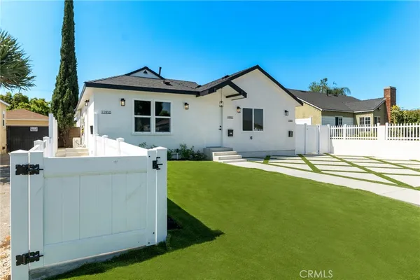a front view of a house with yard