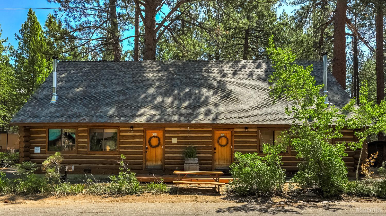 3140 Sacramento Avenue South Lake Tahoe, CA 96150 - Photo 1 of 30 a front view of a house with garden