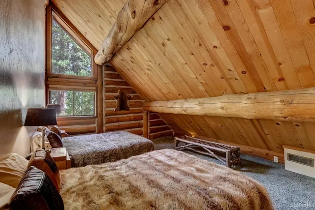 a bedroom with furniture and a window