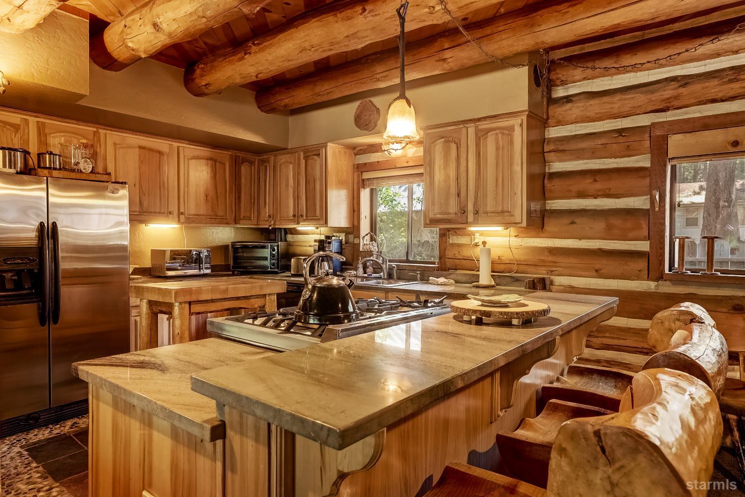 3140 Sacramento Avenue South Lake Tahoe, CA 96150 - Photo 19 of 30 a kitchen with a stove a sink and a refrigerator