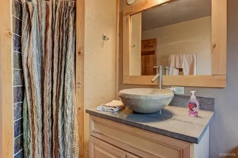 a view of a bathroom with a tub and sink
