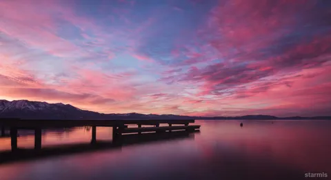 a view of a lake in middle of forest