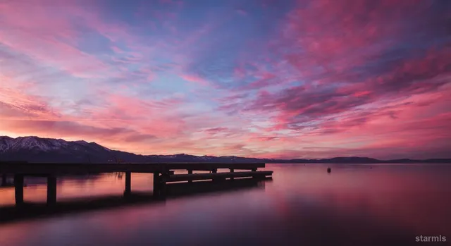 a view of a lake in middle of forest