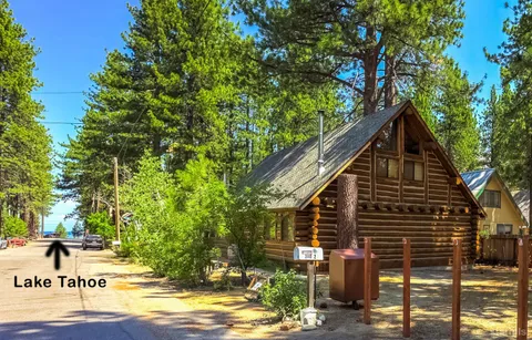 a view of a house with brick walls