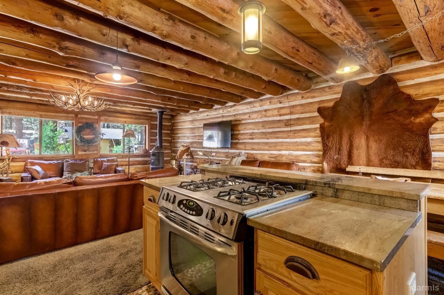 3140 Sacramento Avenue South Lake Tahoe, CA 96150 - Photo 10 of 30 a kitchen with a stove and a sink