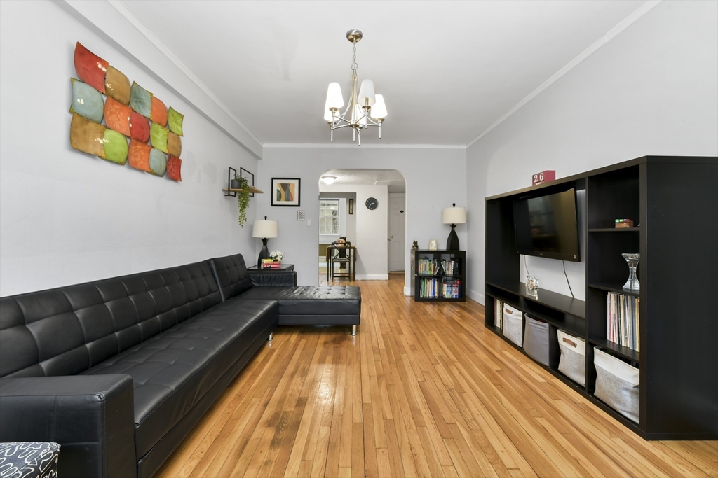 1490 Beacon Street, Unit 1A Brookline, MA 02446 - Photo 13 of 15 a living room with furniture and a flat screen tv