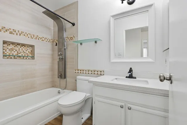 a bathroom with a sink a toilet and a bathtub