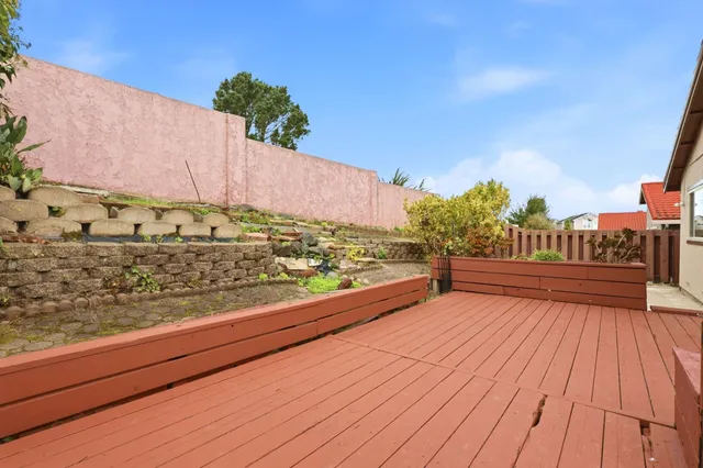 a view of a balcony with wooden floor