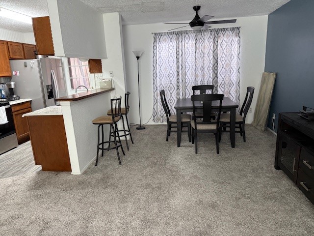 7130 Everhart Road, Unit 14 Corpus Christi, TX 78413 - Photo 3 of 8 a view of a dining room with furniture and a chandelier