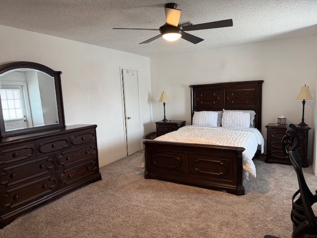 7130 Everhart Road, Unit 14 Corpus Christi, TX 78413 - Photo 4 of 8 a room with a bed and a dresser
