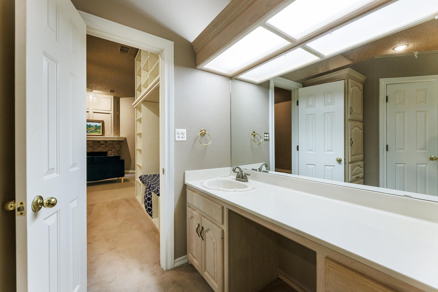 206 Collins Avenue Sundown, TX 79372 - Photo 34 of 82 a bathroom with a sink and a mirror