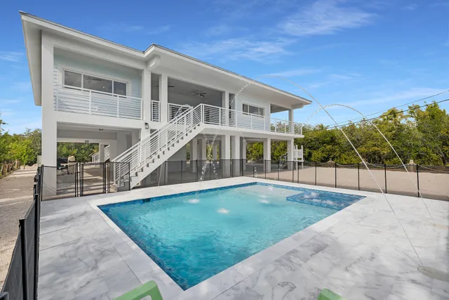 a view of a house with a swimming pool