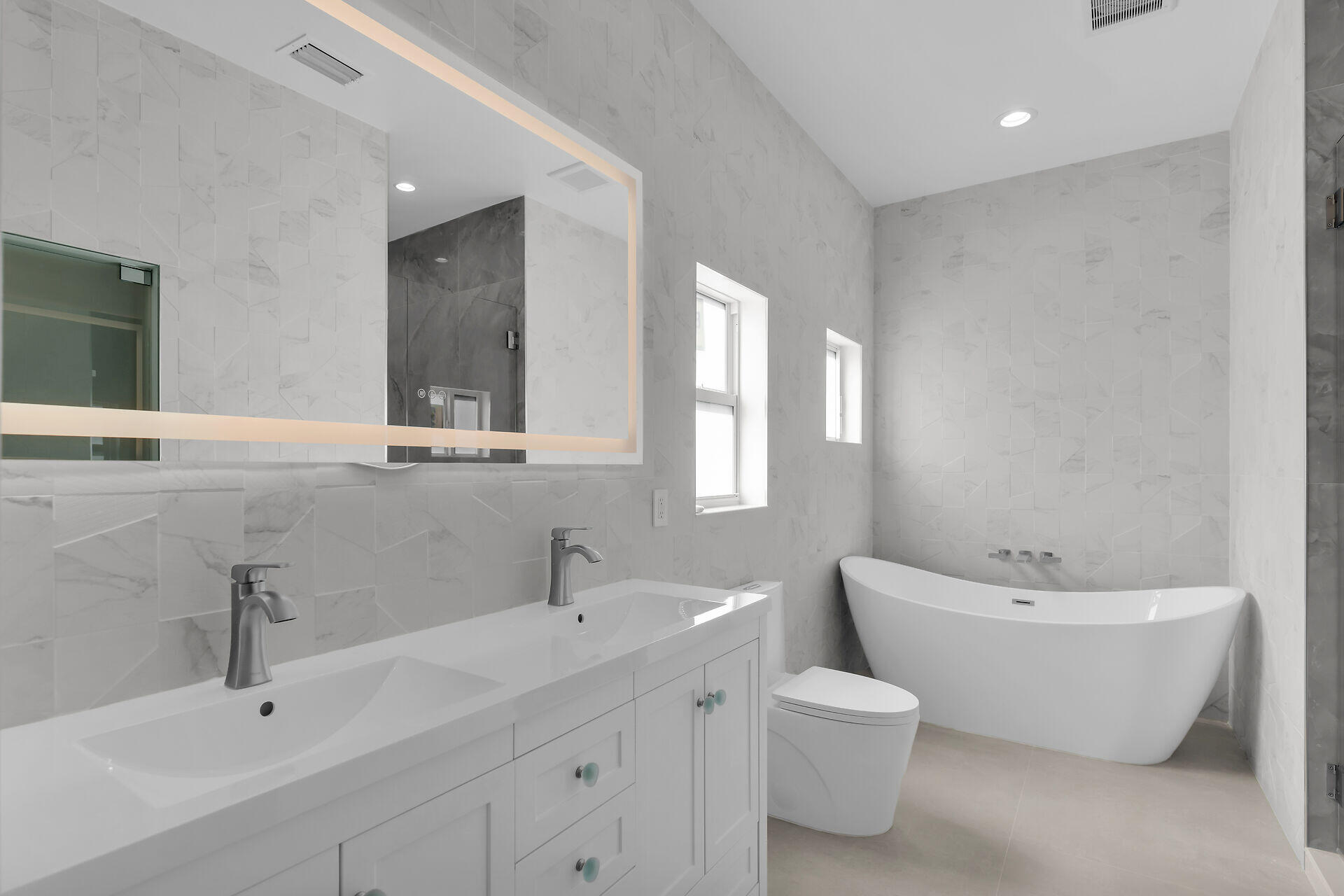 1508 Shaw Drive Key Largo, FL 33037 - Photo 26 of 68 a bathroom with a toilet sink and mirror